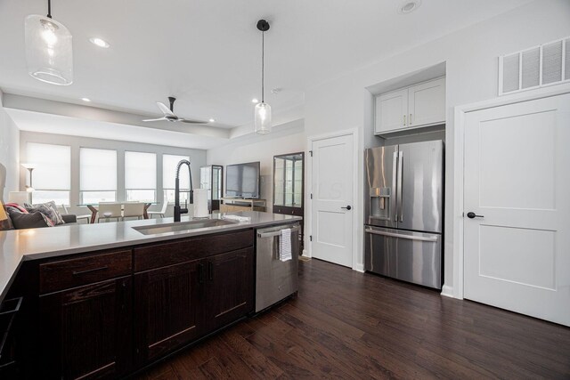 199 E 5th Ave, Columbus, OH 43201 - kitchen featuring appliances with stainless steel finishes, a sink, open floor plan, dark wood-style floors, and light countertops