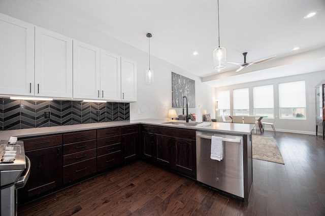 199 E 5th Ave, Columbus, OH 43201 - kitchen featuring appliances with stainless steel finishes, a sink, a peninsula, ceiling fan, and white cabinetry