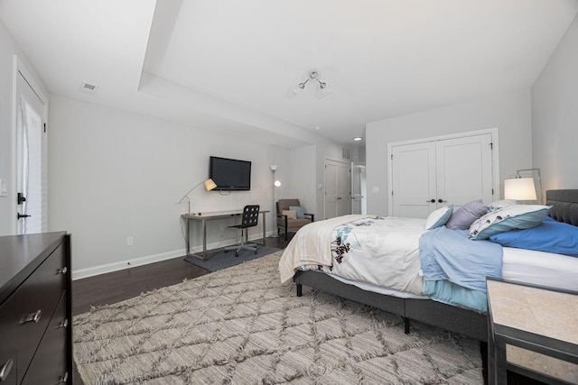 199 E 5th Ave, Columbus, OH 43201 - bedroom with wood finished floors, multiple closets, and baseboards