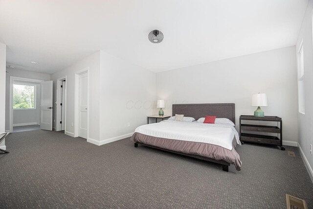 199 E 5th Ave, Columbus, OH 43201 - carpeted bedroom featuring baseboards
