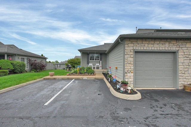 4057 Blendon Point Dr Unit 60A, Columbus, OH 43230 - view of front of house featuring stone siding, uncovered parking, and a front yard