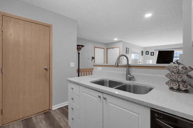 4057 Blendon Point Dr Unit 60A, Columbus, OH 43230 - kitchen featuring dishwasher, a sink, dark wood-style flooring, a textured ceiling, and light stone counters