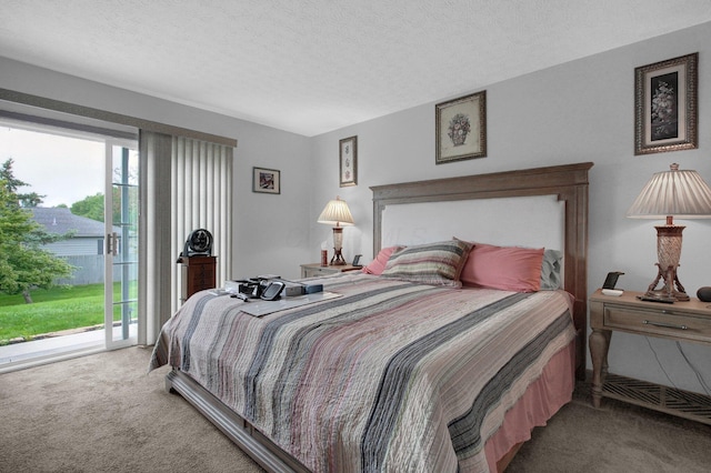 4057 Blendon Point Dr Unit 60A, Columbus, OH 43230 - bedroom featuring carpet, access to outside, and a textured ceiling