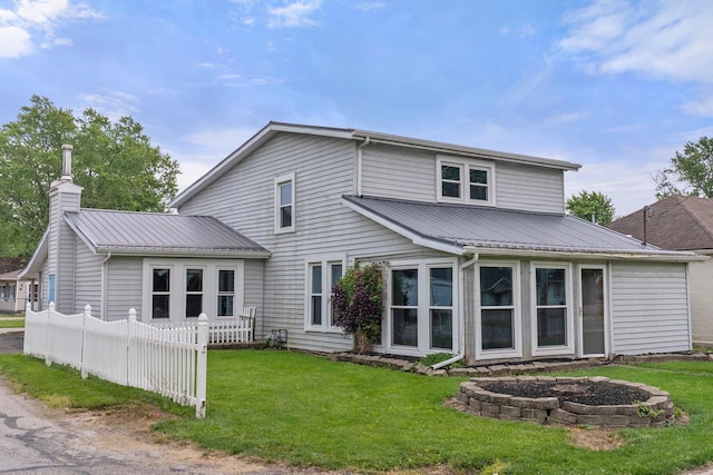 11007 Hebron Rd, Buckeye Lake, OH 43008 - rear view of property featuring a chimney and metal roof