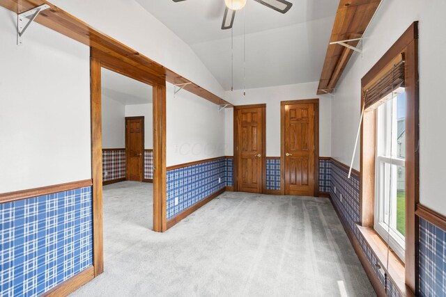 11007 Hebron Rd, Buckeye Lake, OH 43008 - unfurnished room with a wainscoted wall, lofted ceiling, carpet flooring, and ceiling fan