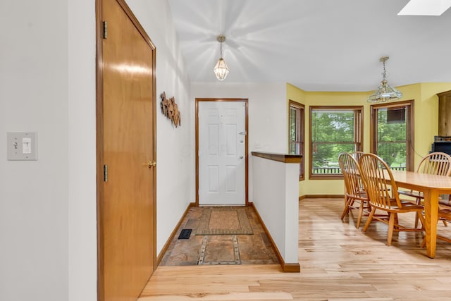 3753 Homer Rd NW, Utica, OH 43080 - foyer featuring baseboards, a skylight, and light wood finished floors