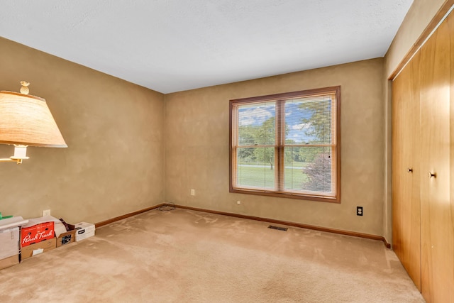 3753 Homer Rd NW, Utica, OH 43080 - unfurnished bedroom with carpet flooring, baseboards, and a closet