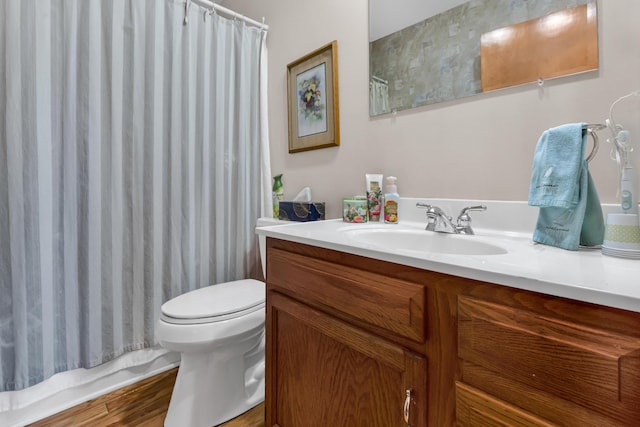 3753 Homer Rd NW, Utica, OH 43080 - bathroom with vanity, toilet, curtained shower, and wood finished floors