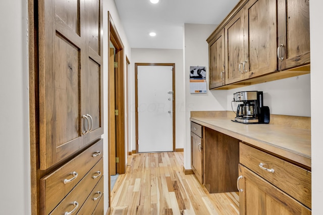 3753 Homer Rd NW, Utica, OH 43080 - kitchen with light wood-style flooring, light countertops, recessed lighting, baseboards, and brown cabinetry