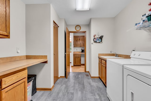 3753 Homer Rd NW, Utica, OH 43080 - washroom with independent washer and dryer, light wood-type flooring, cabinet space, and baseboards