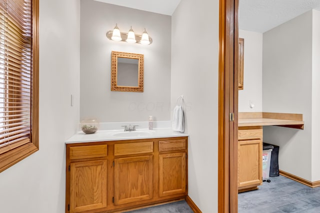 3753 Homer Rd NW, Utica, OH 43080 - bathroom featuring vanity, baseboards, and wood finished floors
