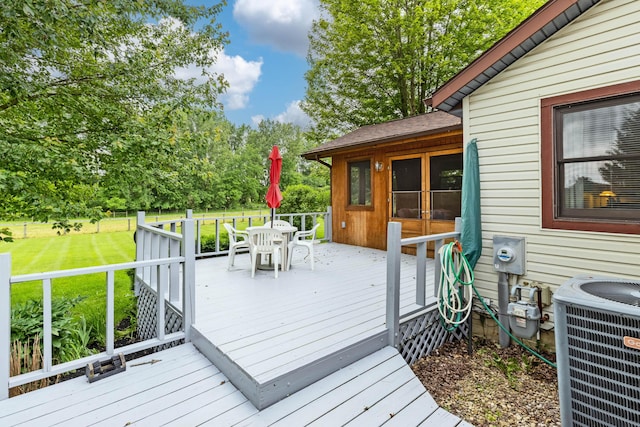 3753 Homer Rd NW, Utica, OH 43080 - deck featuring outdoor dining space, cooling unit, a yard, and view of scattered trees