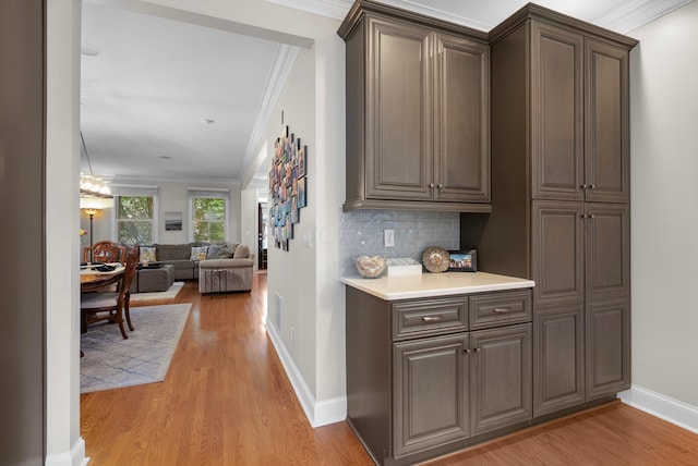 1054 Perry St, Columbus, OH 43201 - hall with crown molding, light wood-style floors, and baseboards