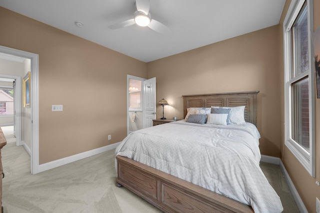 1054 Perry St, Columbus, OH 43201 - bedroom featuring light carpet, baseboards, and ceiling fan