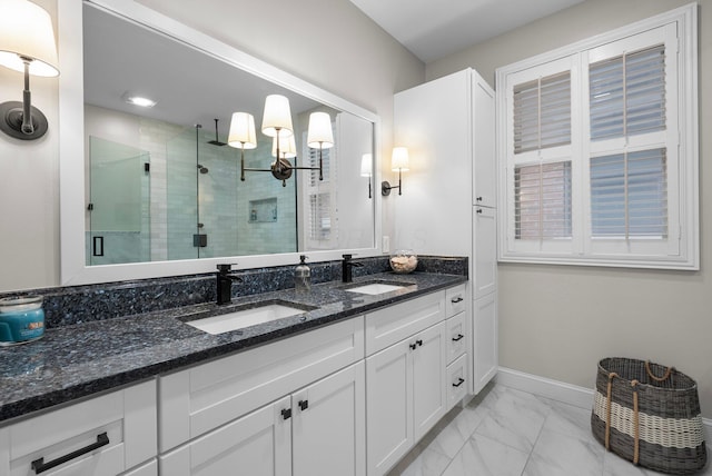 1054 Perry St, Columbus, OH 43201 - bathroom with marble look tiles, a shower stall, double vanity, and baseboards