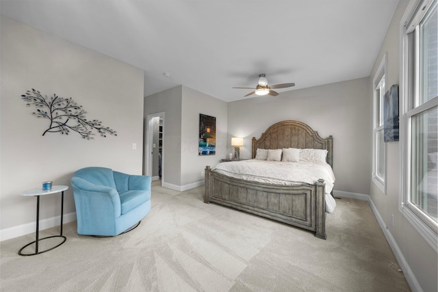 1054 Perry St, Columbus, OH 43201 - bedroom with light carpet, baseboards, and ceiling fan
