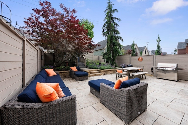 1054 Perry St, Columbus, OH 43201 - fenced backyard with a patio, outdoor dining space, and grilling area