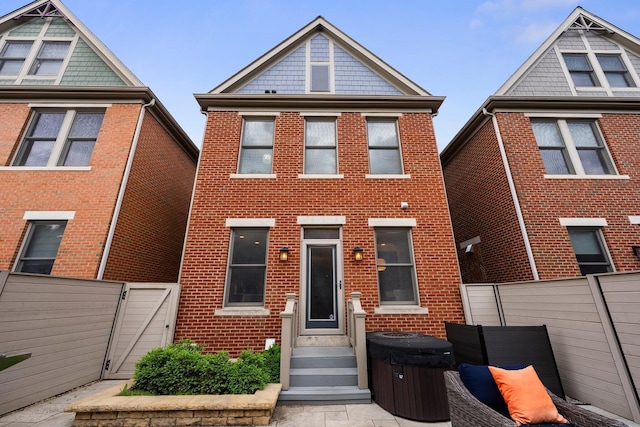 1054 Perry St, Columbus, OH 43201 - view of front of property featuring a gate, brick siding, and entry steps