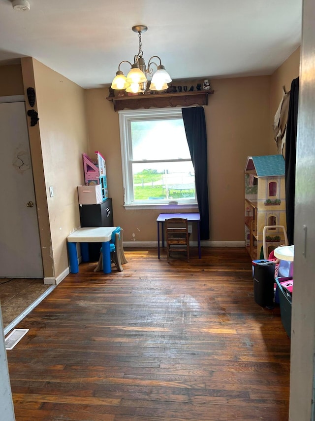 416 Reese Ave, Lancaster, OH 43130 - game room with a chandelier, wood finished floors, and baseboards