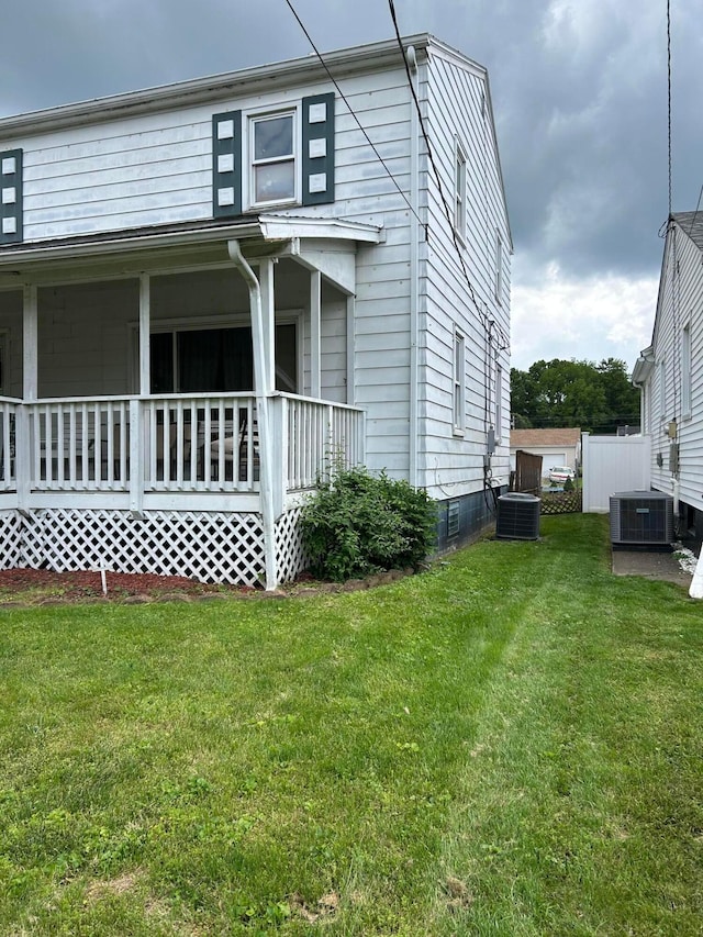 416 Reese Ave, Lancaster, OH 43130 - view of side of property with central AC unit, a lawn, and a porch