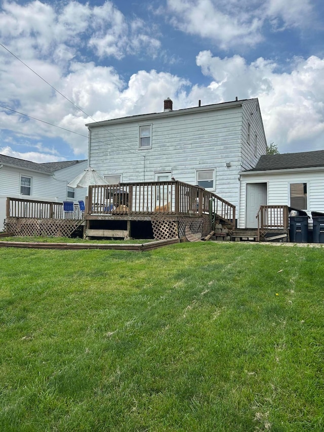 416 Reese Ave, Lancaster, OH 43130 - rear view of property with a wooden deck, a chimney, and a lawn