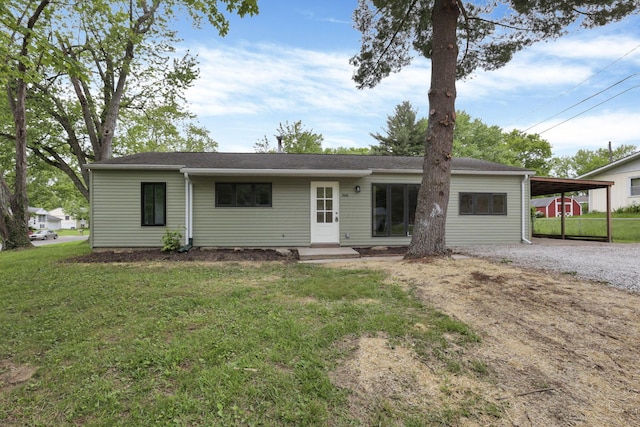 366 Orchard Ln, Sunbury, OH 43074 - ranch-style house featuring dirt driveway, a front lawn, and a carport