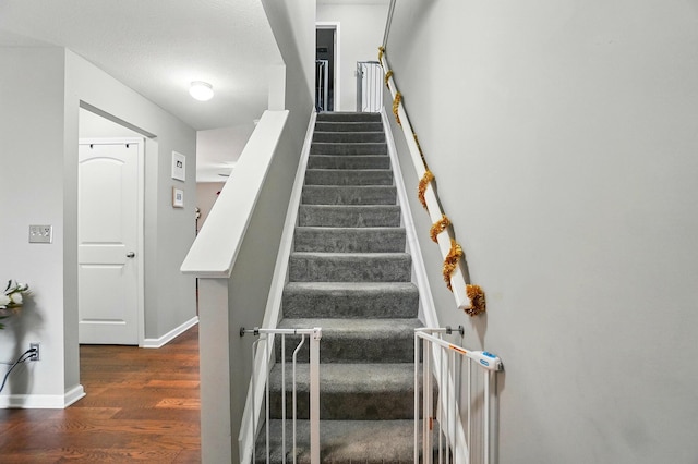 218 Christian St, Delaware, OH 43015 - staircase featuring wood finished floors and baseboards