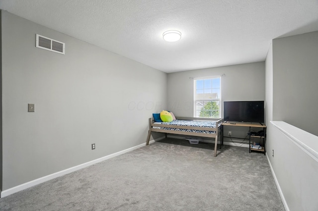 218 Christian St, Delaware, OH 43015 - carpeted bedroom with baseboards and a textured ceiling