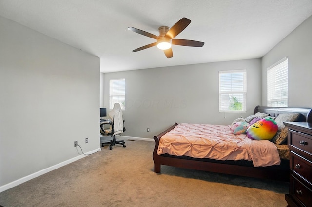 218 Christian St, Delaware, OH 43015 - bedroom featuring baseboards, light carpet, and a ceiling fan