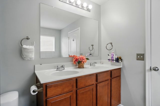 218 Christian St, Delaware, OH 43015 - bathroom featuring double vanity and toilet
