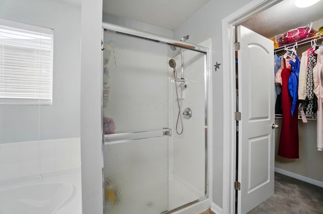 218 Christian St, Delaware, OH 43015 - bathroom with a shower stall, a bath, and a spacious closet