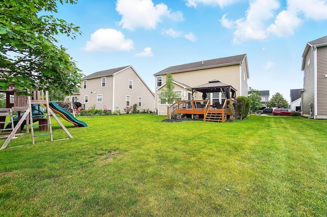 218 Christian St, Delaware, OH 43015 - rear view of house with a gazebo, a playground, and a yard