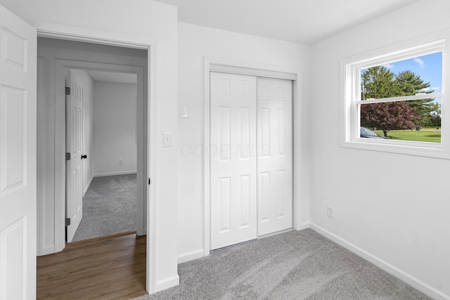 70 5th Ave SW, Etna, OH 43062 - unfurnished bedroom with baseboards, carpet flooring, and a closet