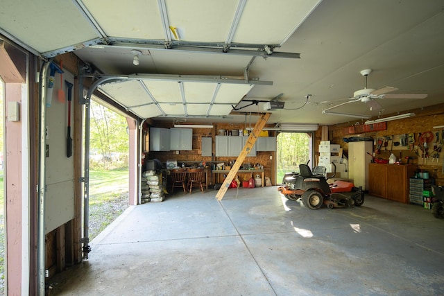 7326 State Route 19 Unit 5, Lot 105-107, Mount Gilead, OH 43338 - garage featuring a garage door opener and a workshop area