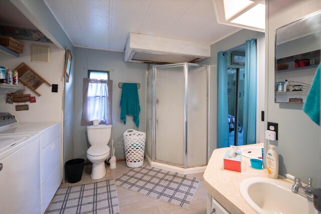 7326 State Route 19 Unit 5, Lot 105-107, Mount Gilead, OH 43338 - bathroom with washer and dryer, vanity, a stall shower, and toilet