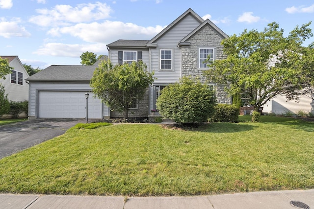 1779 Westwood Dr, Lewis Center, OH 43035 - traditional-style house with driveway, a front lawn, a garage, and stone siding