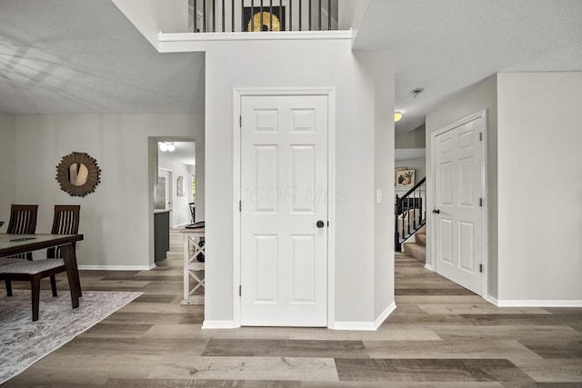 1779 Westwood Dr, Lewis Center, OH 43035 - foyer featuring wood finished floors, baseboards, stairway, and a textured ceiling
