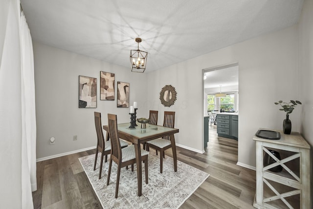 1779 Westwood Dr, Lewis Center, OH 43035 - dining space with a chandelier, dark wood-style floors, and baseboards