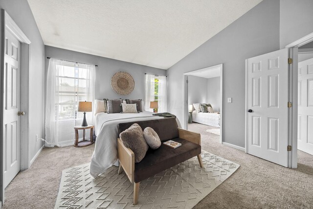 1779 Westwood Dr, Lewis Center, OH 43035 - bedroom with carpet flooring, multiple windows, lofted ceiling, a textured ceiling, and baseboards