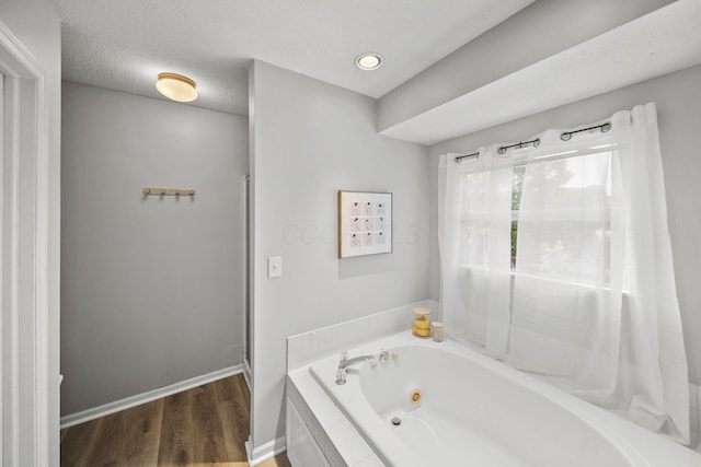 1779 Westwood Dr, Lewis Center, OH 43035 - full bathroom with a whirlpool tub, wood finished floors, a stall shower, baseboards, and recessed lighting