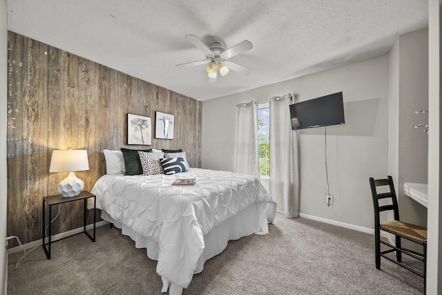 1779 Westwood Dr, Lewis Center, OH 43035 - bedroom with wood walls, carpet flooring, baseboards, a ceiling fan, and a textured ceiling