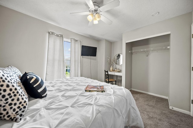 1779 Westwood Dr, Lewis Center, OH 43035 - carpeted bedroom featuring a textured ceiling, a closet, ceiling fan, and baseboards
