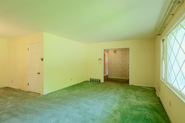 1602 Pleasantview Dr, Lancaster, OH 43130 - empty room with carpet flooring, plenty of natural light, and baseboards
