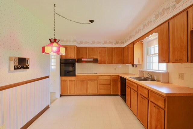 1602 Pleasantview Dr, Lancaster, OH 43130 - kitchen featuring black appliances, wallpapered walls, a sink, under cabinet range hood, and light flooring