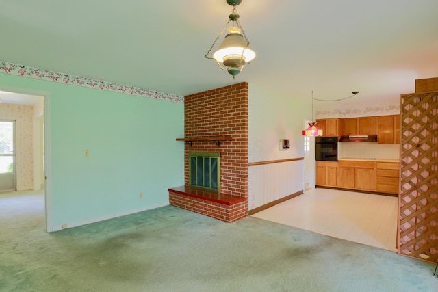 1602 Pleasantview Dr, Lancaster, OH 43130 - unfurnished living room featuring carpet flooring and a fireplace