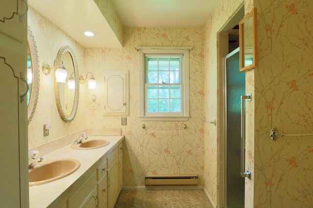 1602 Pleasantview Dr, Lancaster, OH 43130 - bathroom with a baseboard radiator, double vanity, a stall shower, baseboards, and wallpapered walls