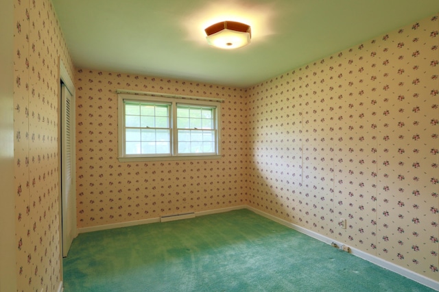 1602 Pleasantview Dr, Lancaster, OH 43130 - carpeted empty room with a baseboard radiator and wallpapered walls