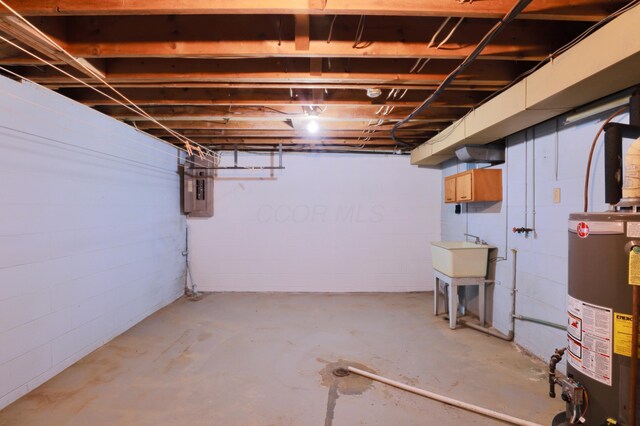 1602 Pleasantview Dr, Lancaster, OH 43130 - unfinished basement featuring gas water heater, electric panel, concrete block wall, and a sink