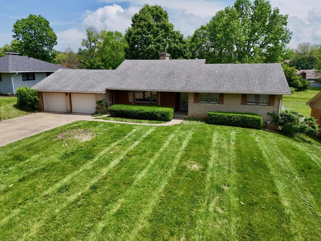 1602 Pleasantview Dr, Lancaster, OH 43130 - ranch-style home featuring a garage, a chimney, driveway, a front lawn, and a shingled roof