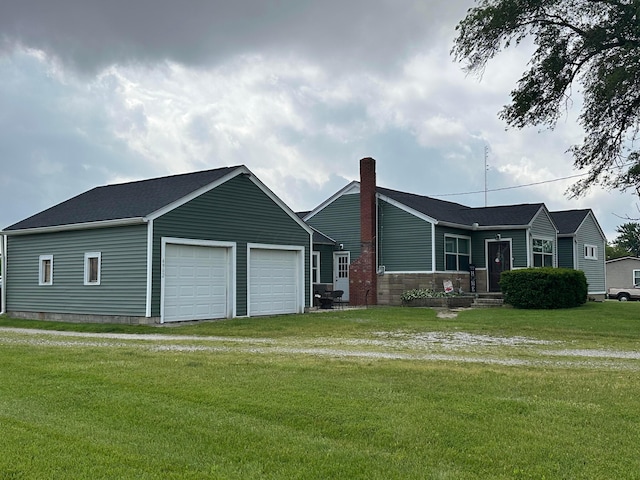 4902 Columbus Sandusky Rd N, Marion, OH 43302 - view of front of house featuring a garage, a front lawn, a chimney, and driveway